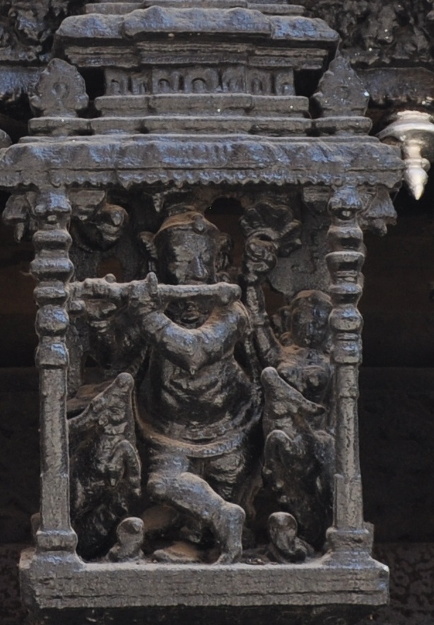 Krishna with his flute, carved on the Suchindram Temple car