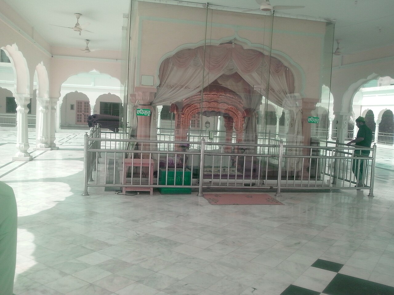The railed and curtained canopy inside Gurdwara Janam Asthan marking the spot held to be Guru Nanak Dev Ji's birthplace