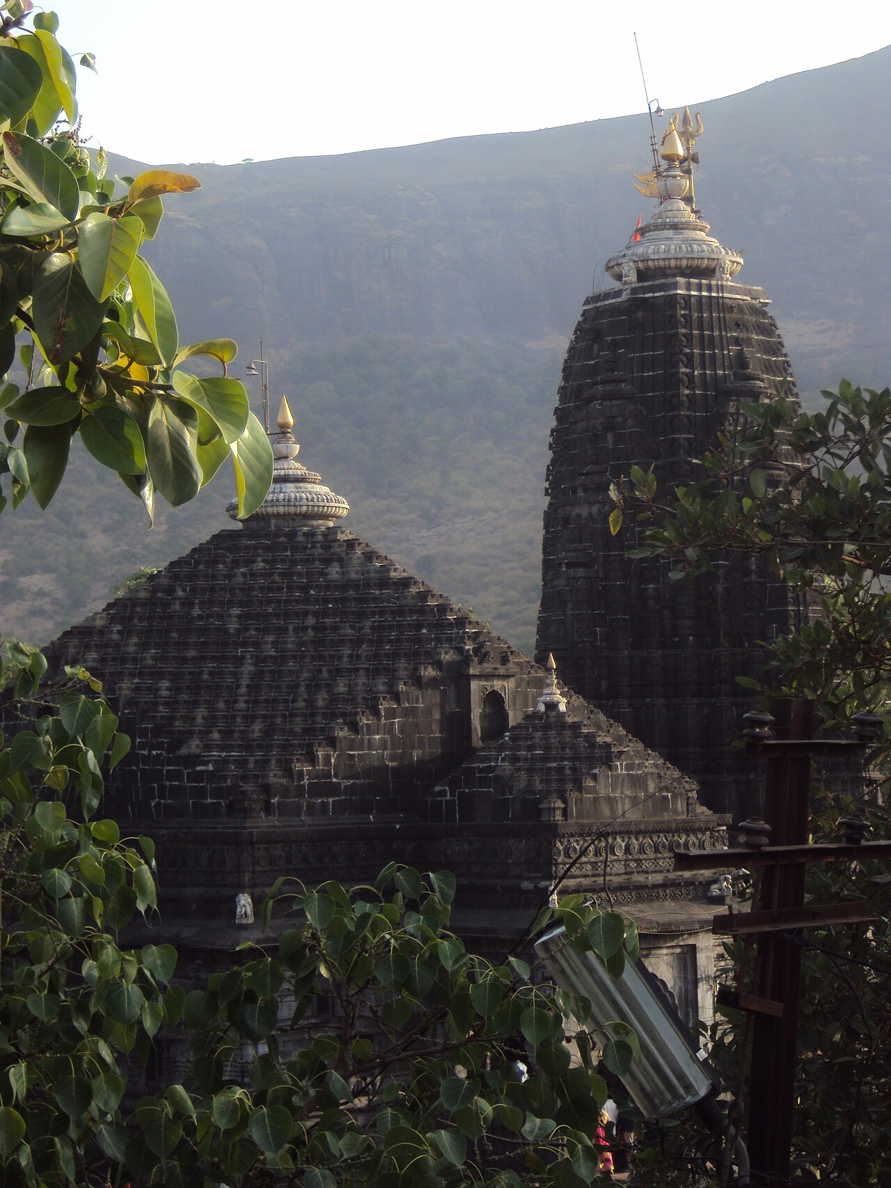 The black basalt shikharas of Shri Trimbakeshwar Temple beneath the cliffs of Brahmagiri