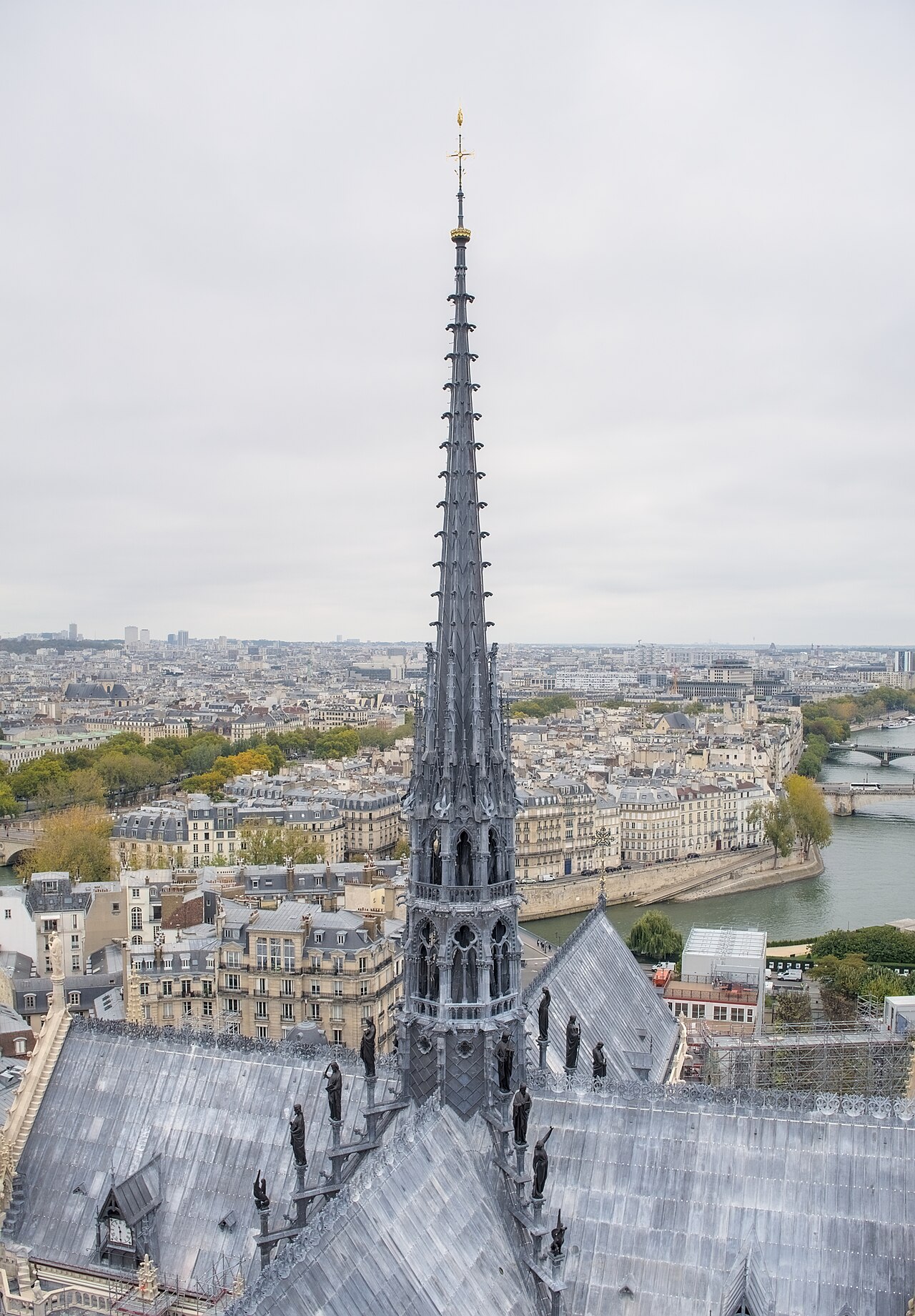The rebuilt spire of Notre-Dame de Paris seen from the south tower, its gilded rooster at the summit