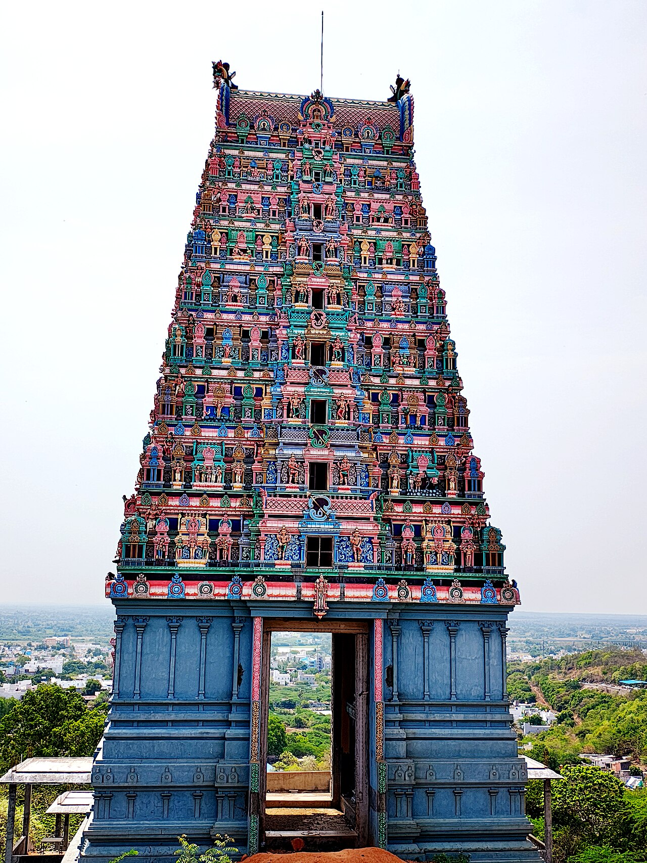 The painted rajagopuram of the Tiruttani Temple with the plains stretching out far below