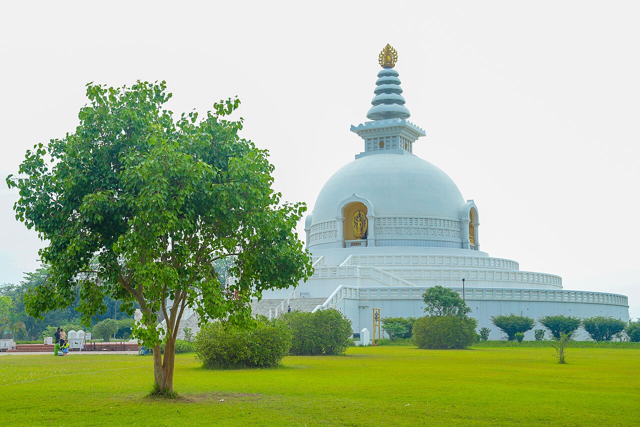 The white dome of the World Peace Pagoda at the northern end of Lumbini's master plan axis