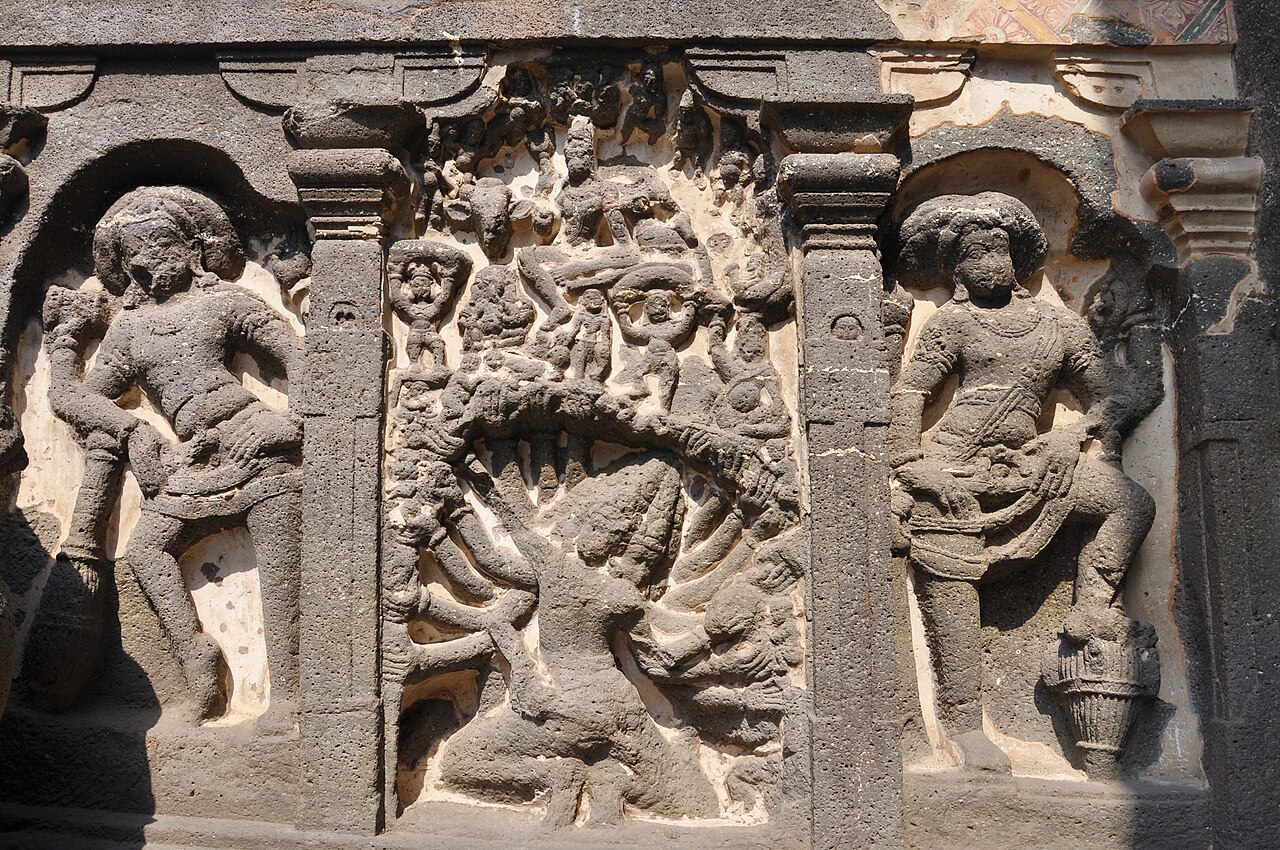 The Ravana shaking Mount Kailasa relief on the Kailasa Temple, the many-armed king straining beneath the mountain