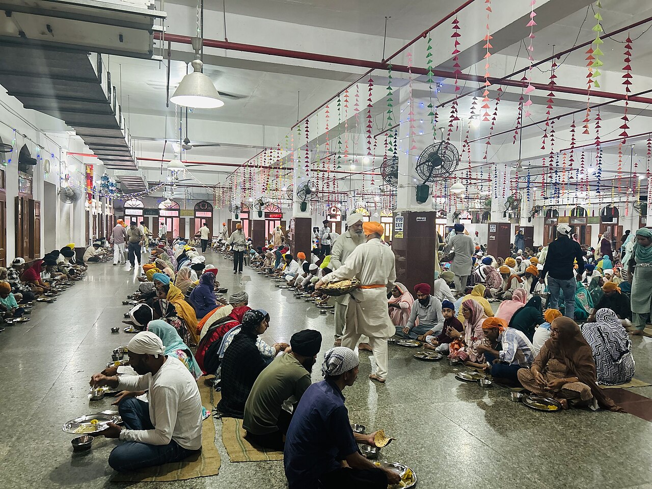 Sevadars and sangat in Guru Ka Langar, the free community kitchen of Sri Harmandir Sahib