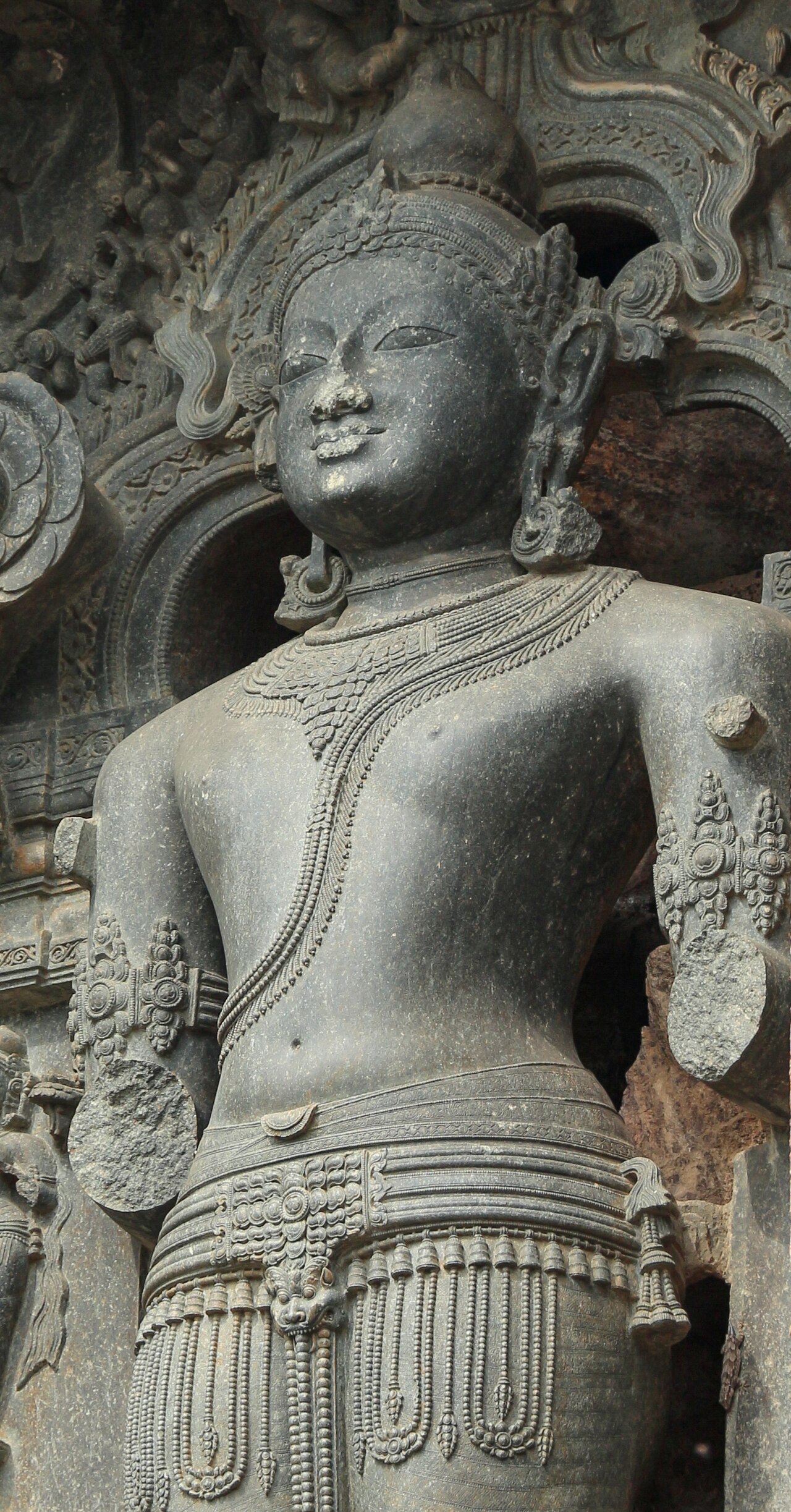 A chlorite image of Lord Surya standing in a niche of the Konark Sun Temple
