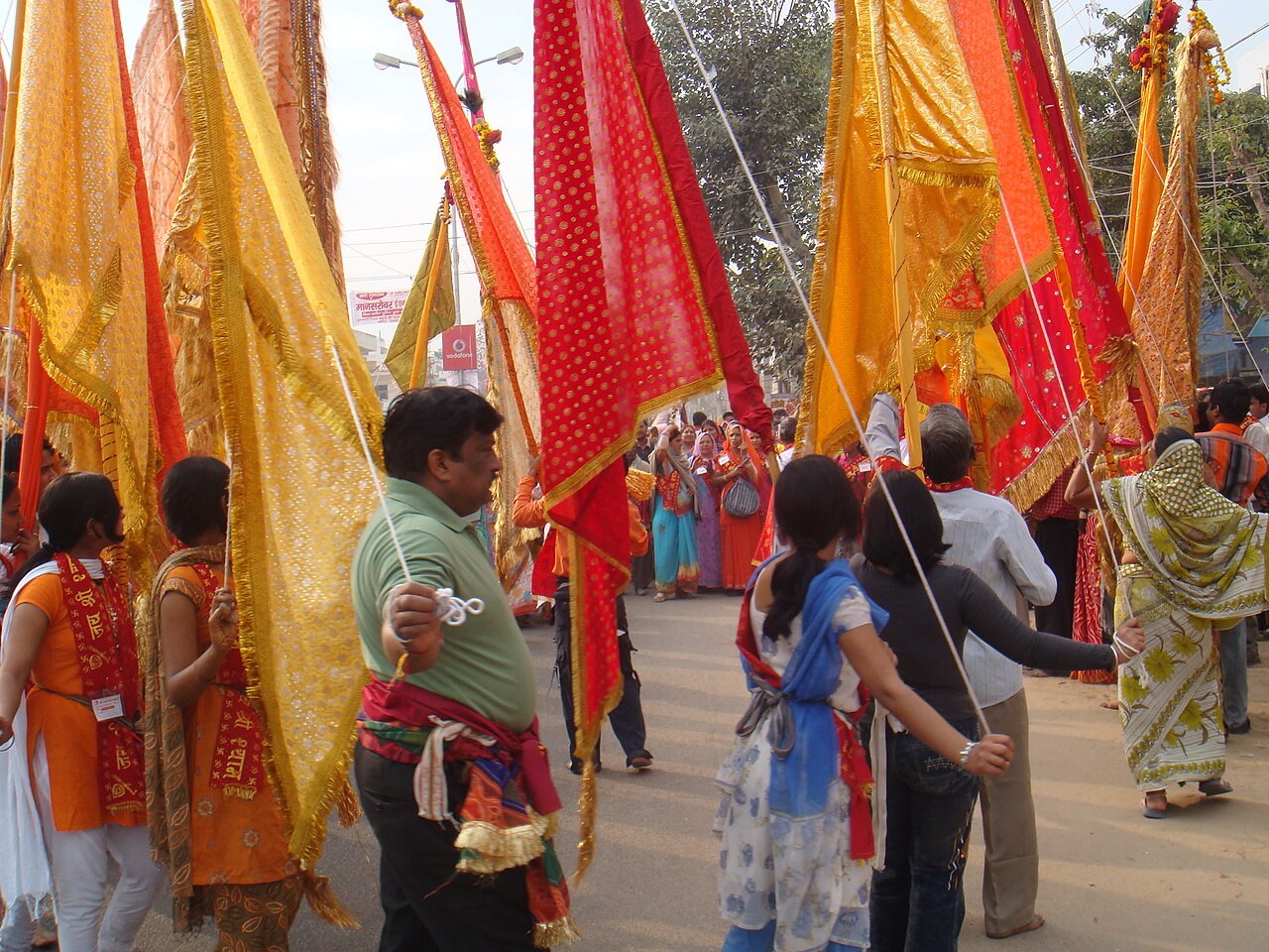 Devotees raise saffron and red nishan flags as a padyatra for Khatu Shyam Ji sets out from Jaipur