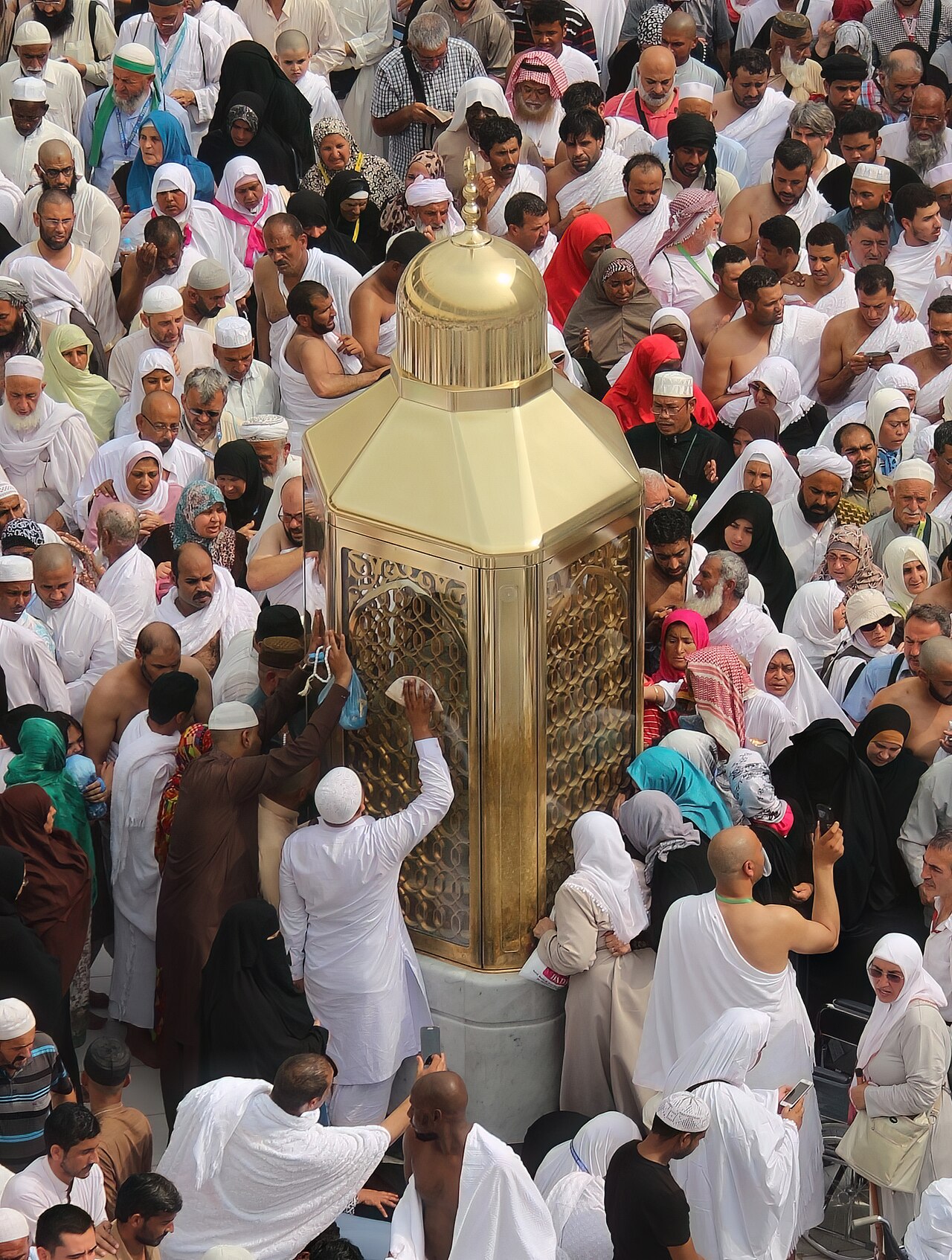 The golden crystal enclosure of Maqam Ibrahim before the Kaaba in al-Masjid al-Haram