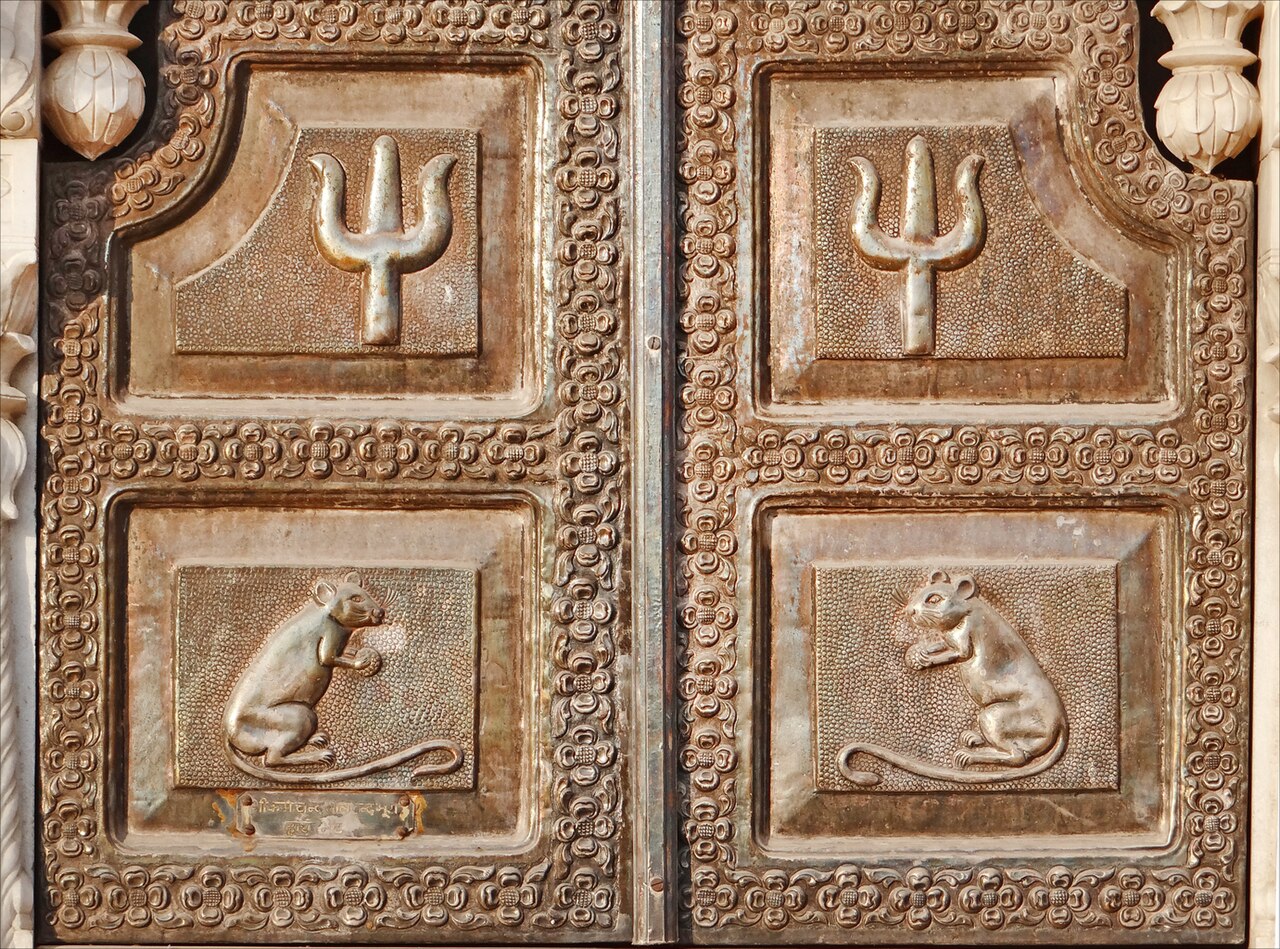 Worked silver door panels at Maa Karni Mata Temple, Deshnoke, depicting the legends of the Goddess
