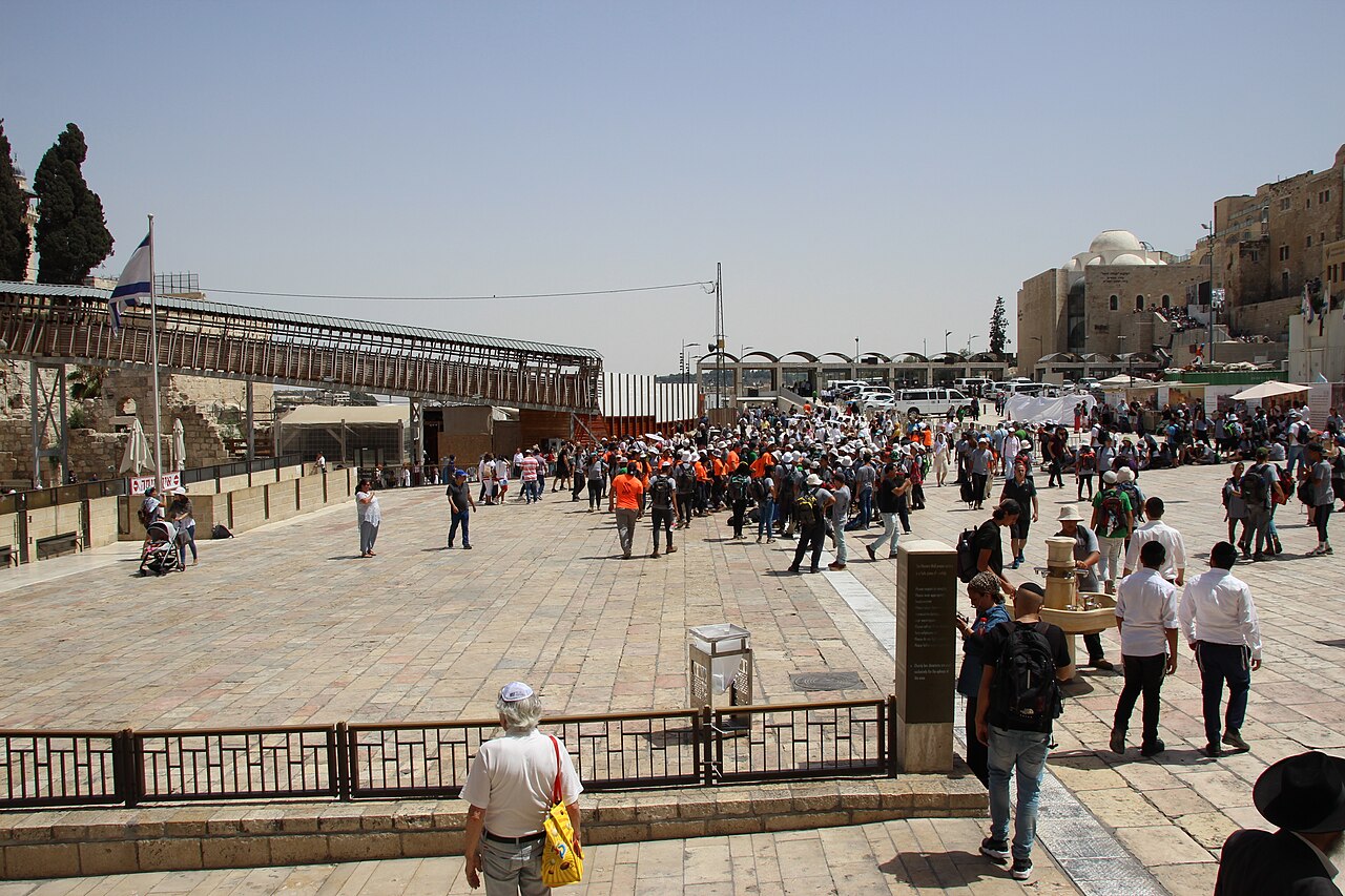 The Western Wall plaza in the Old City of Jerusalem, with worshippers before the Herodian stones
