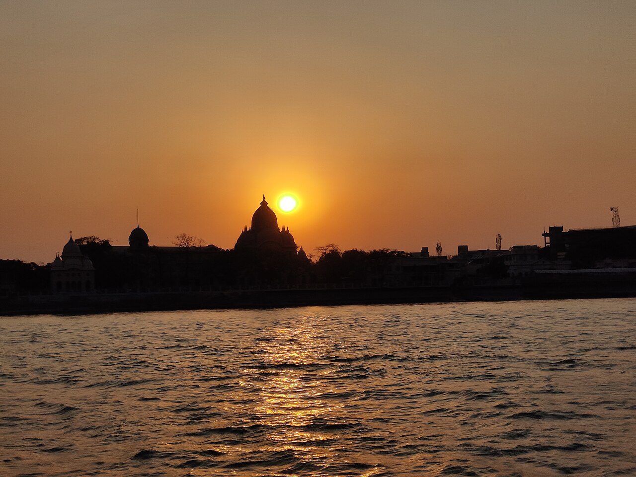 The domes of Belur Math against the sunset, seen from the Hooghly on the ferry crossing