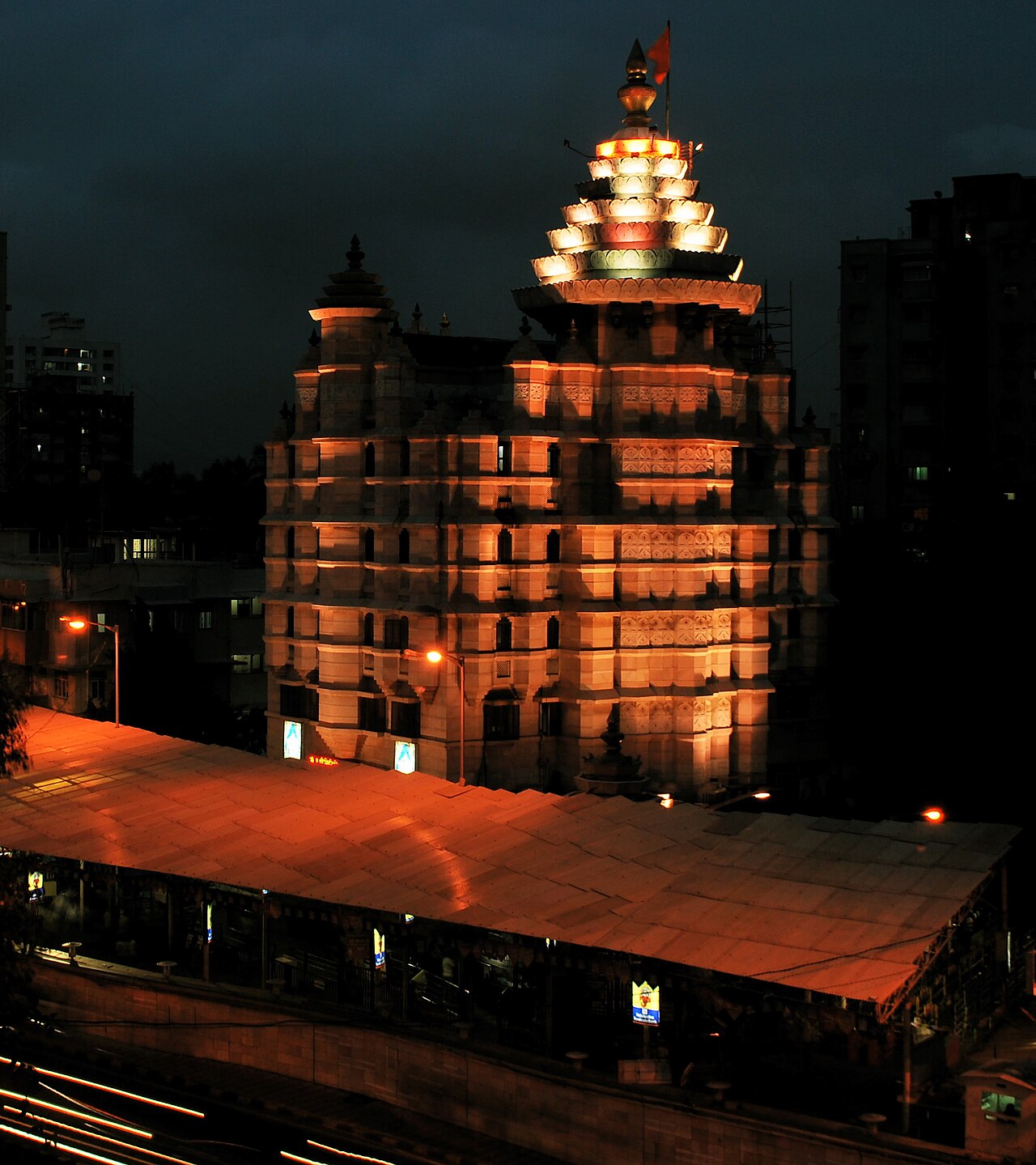 The six-storey Siddhivinayak Temple and its lit crown rising above Prabhadevi at night