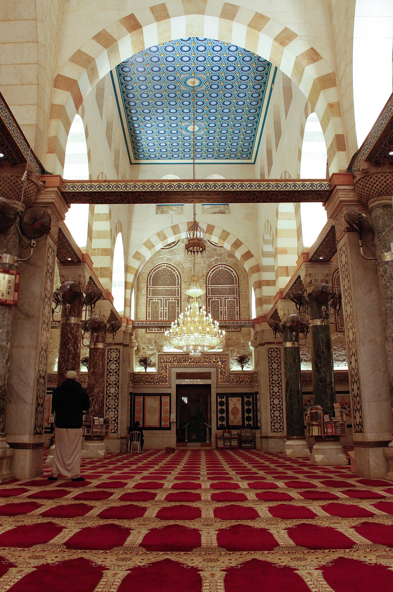 Marble columns and carpets inside the prayer hall of the Qibli Mosque