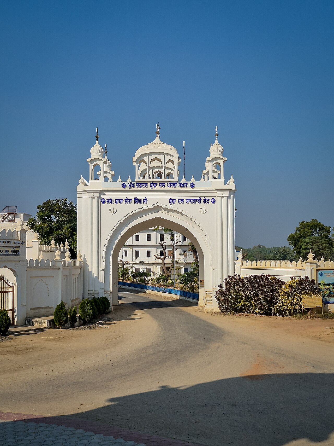 The white memorial gate of the Budha Dal's head office at Takht Sri Damdama Sahib, Talwandi Sabo