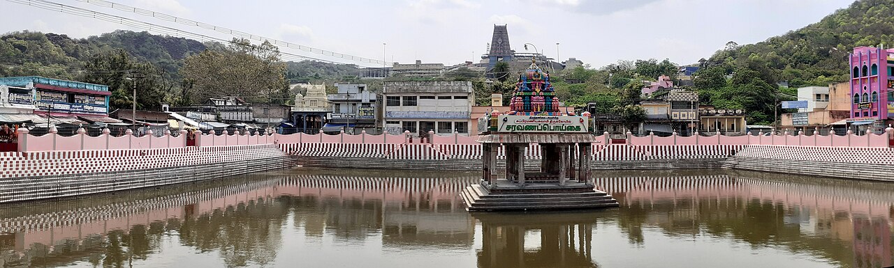 The Saravana Poigai tank at the foot of Thanigai hill, with the hilltop Temple rising behind