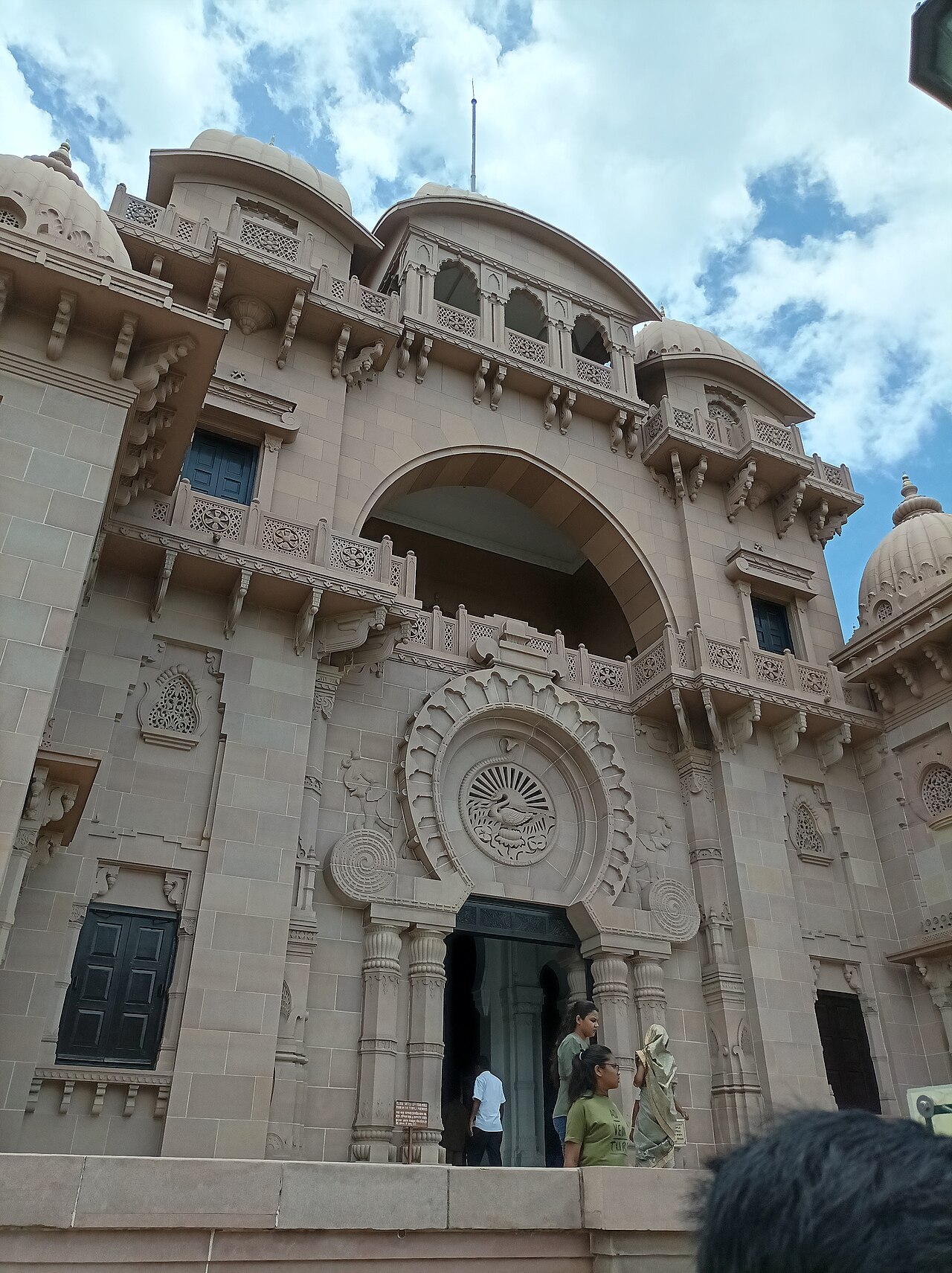 The carved entrance of the Sri Ramakrishna temple at Belur Math, with the emblem Swami Vivekananda designed set above the door