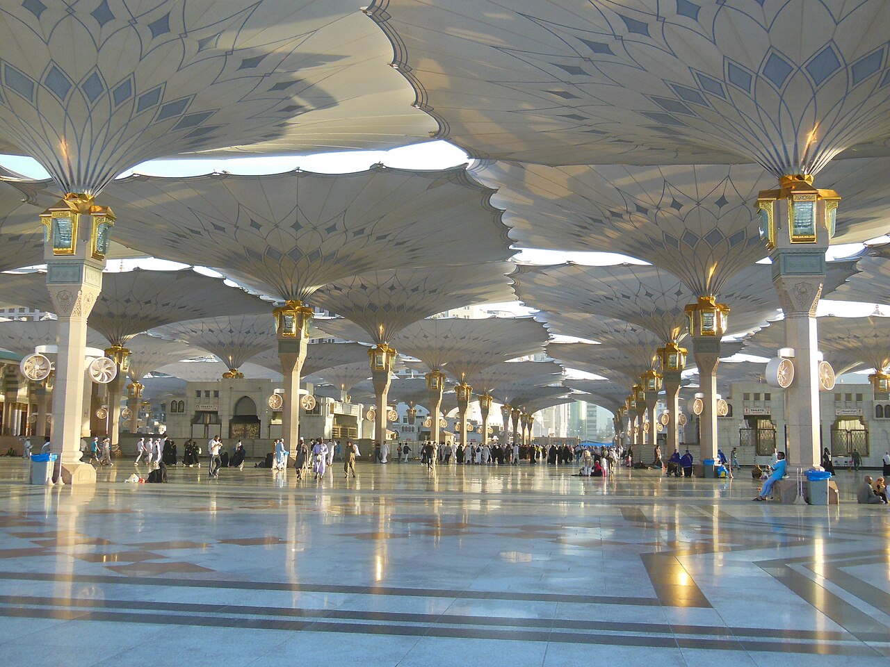 The great retractable umbrellas open over the courtyards of the Prophet's Mosque